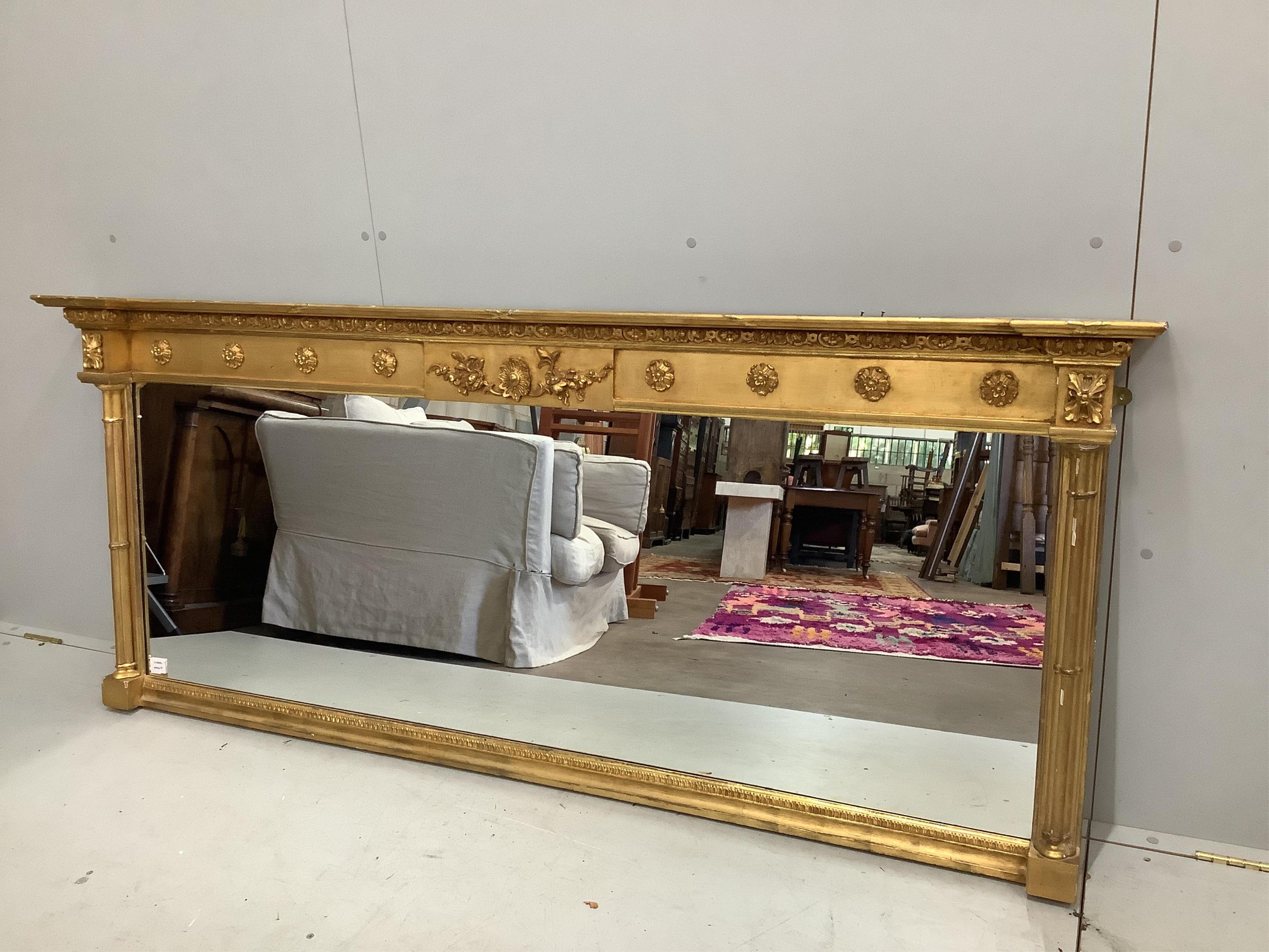 A Regency giltwood and composition overmantel mirror, width 193cm, height 81cm. Condition - fair